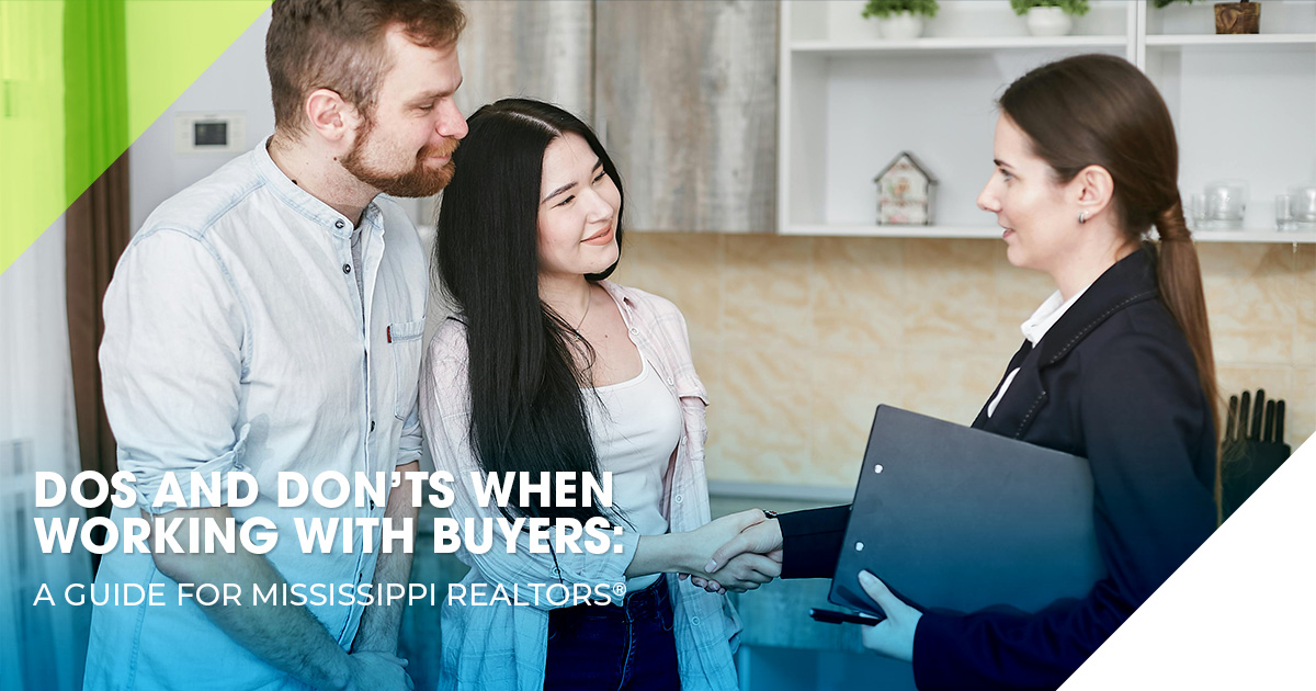 REALTOR® discussing buyer agreement details with a client.