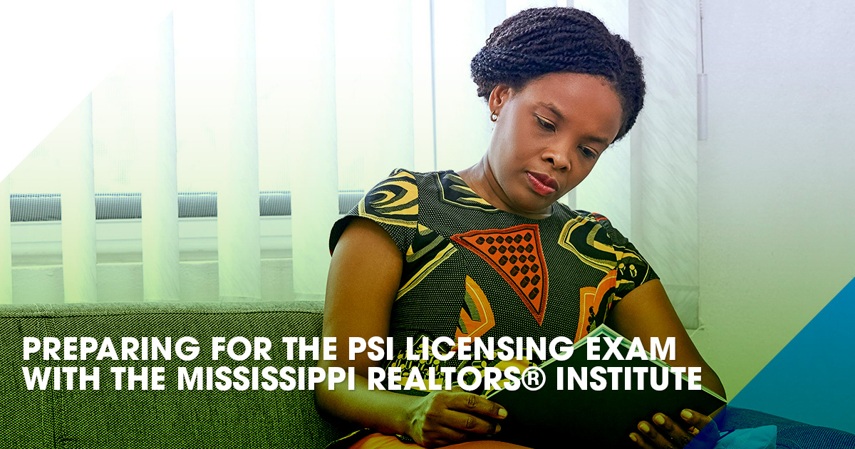 Student prepares for the PSI Licensing exam with pen & paper in front of a computer